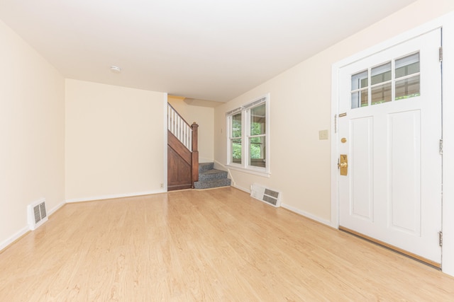 501 W Mosley St, Ann Arbor, MI 48103 - unfurnished living room with light wood finished floors and stairs