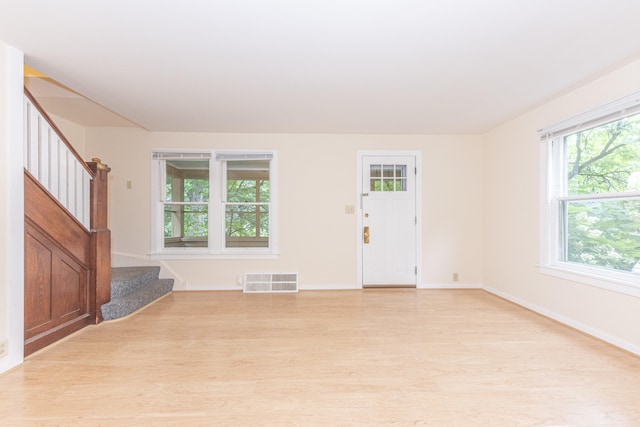 501 W Mosley St, Ann Arbor, MI 48103 - unfurnished living room with light wood-type flooring and stairs
