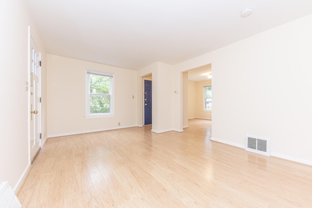 501 W Mosley St, Ann Arbor, MI 48103 - spare room with light wood-type flooring and a smoke detector