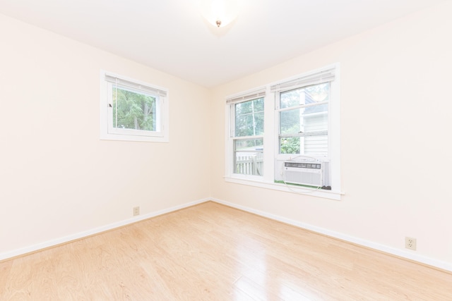 501 W Mosley St, Ann Arbor, MI 48103 - unfurnished room featuring wood finished floors and cooling unit
