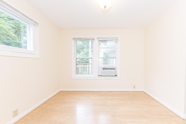 501 W Mosley St, Ann Arbor, MI 48103 - spare room with light wood-style floors, plenty of natural light, and cooling unit