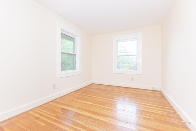 501 W Mosley St, Ann Arbor, MI 48103 - spare room featuring hardwood / wood-style flooring and baseboards