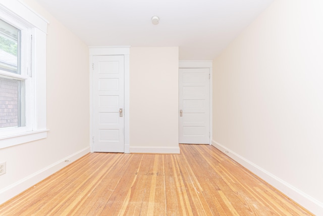 501 W Mosley St, Ann Arbor, MI 48103 - unfurnished bedroom with light wood-type flooring and baseboards
