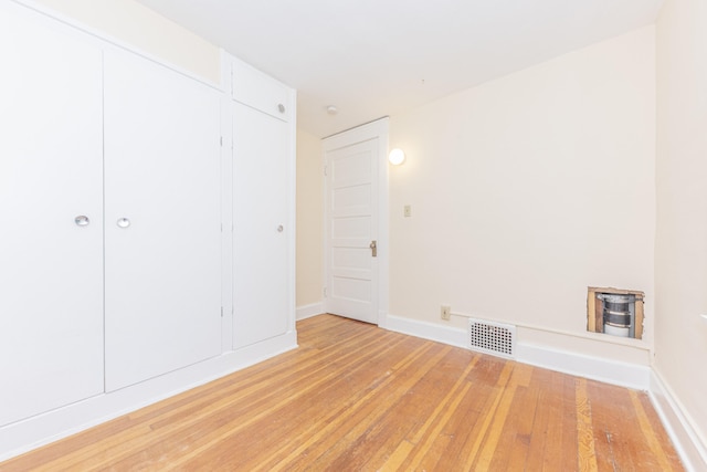 501 W Mosley St, Ann Arbor, MI 48103 - unfurnished bedroom featuring light wood finished floors and a closet