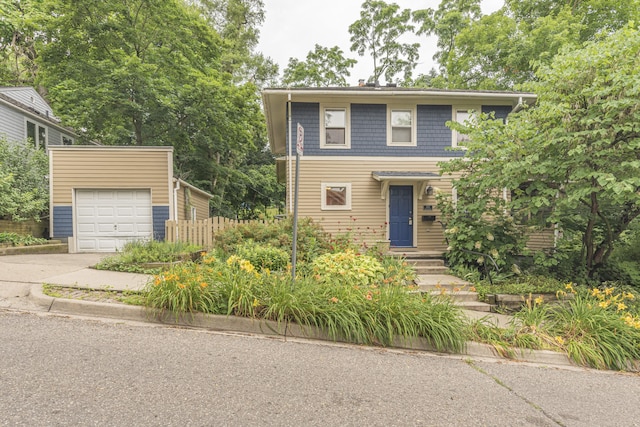 501 W Mosley St, Ann Arbor, MI 48103 - view of front of house with concrete driveway and a garage