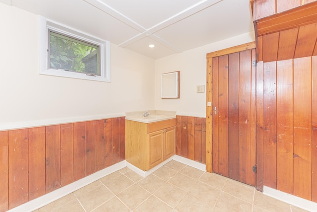 501 W Mosley St, Ann Arbor, MI 48103 - washroom with a wainscoted wall, light tile patterned floors, wood walls, and recessed lighting