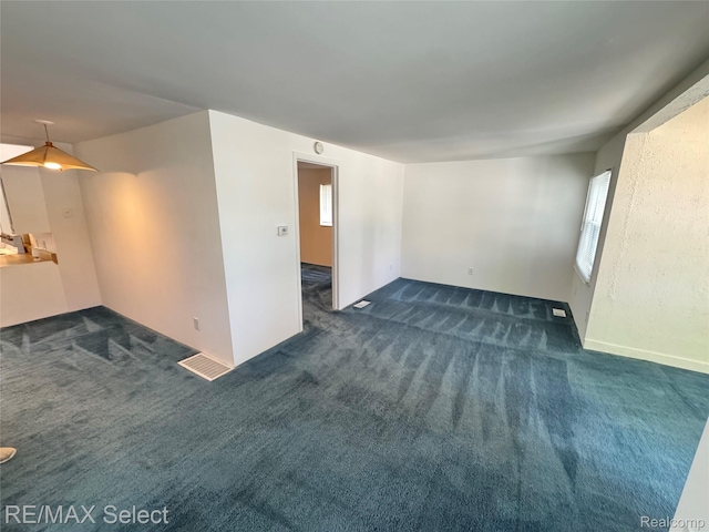 3605 Hogarth Ave, Flint, MI 48532 - unfurnished room featuring carpet floors and plenty of natural light