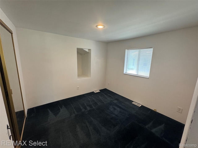 3605 Hogarth Ave, Flint, MI 48532 - unfurnished room featuring dark carpet and recessed lighting