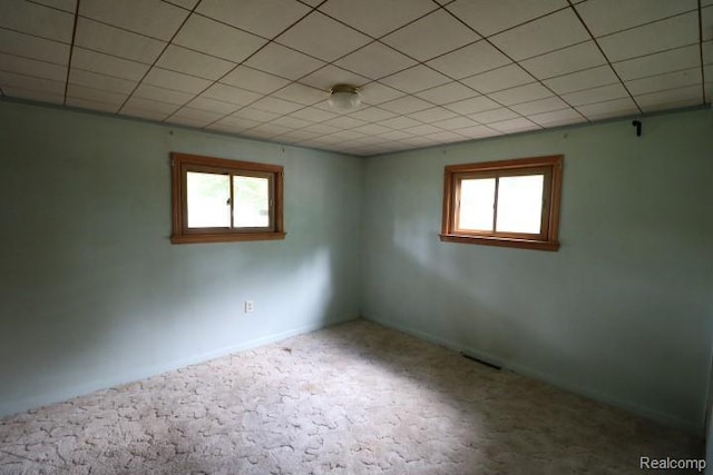 6048 N Lapeer Rd, Fostoria, MI 48435 - empty room featuring plenty of natural light and carpet flooring