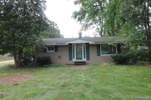 6048 N Lapeer Rd, Fostoria, MI 48435 - single story home with a chimney and a front yard