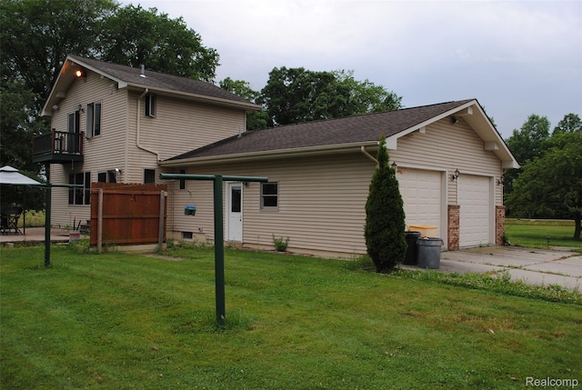 4785 Mayer Rd, China, MI 48054 - view of side of home with a balcony, a lawn, and a garage