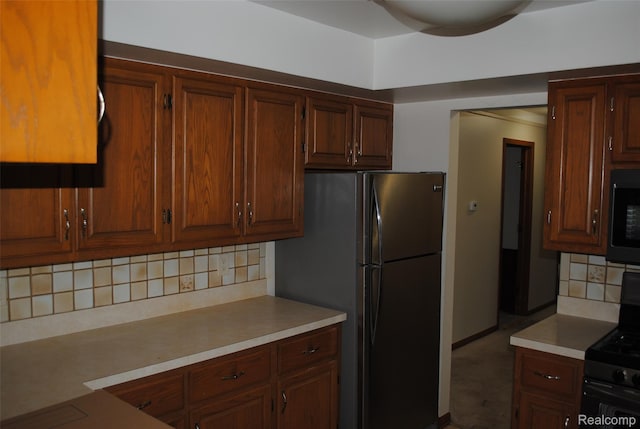 4785 Mayer Rd, China, MI 48054 - kitchen with appliances with stainless steel finishes, backsplash, and light countertops