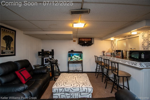 20310 Burt Rd, Detroit, MI 48219 - living room featuring a drop ceiling and carpet floors
