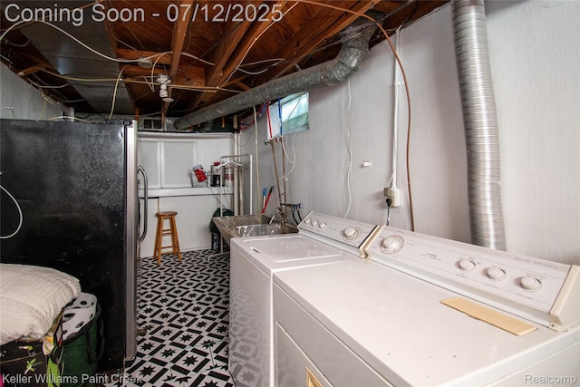 20310 Burt Rd, Detroit, MI 48219 - laundry area featuring washer and clothes dryer and tile patterned floors