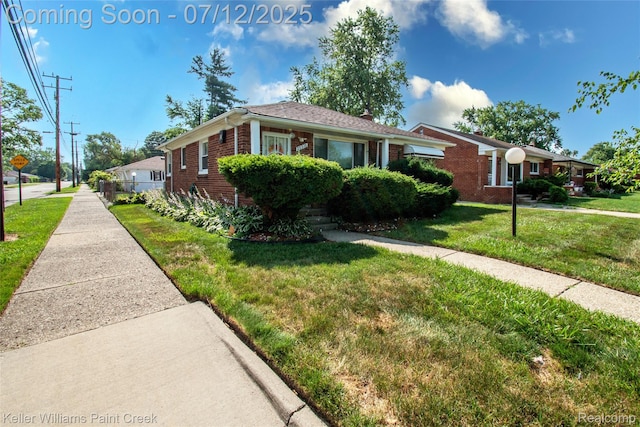 20310 Burt Rd, Detroit, MI 48219 - view of front facade featuring brick siding and a front yard