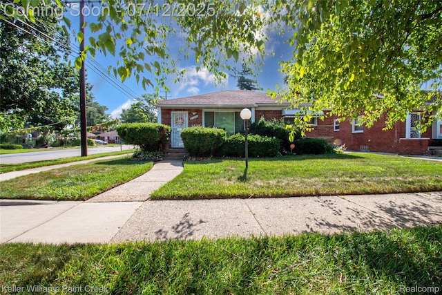 20310 Burt Rd, Detroit, MI 48219 - view of front facade with brick siding and a front lawn
