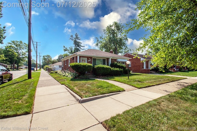 20310 Burt Rd, Detroit, MI 48219 - view of front of home featuring a front lawn, brick siding, and a chimney
