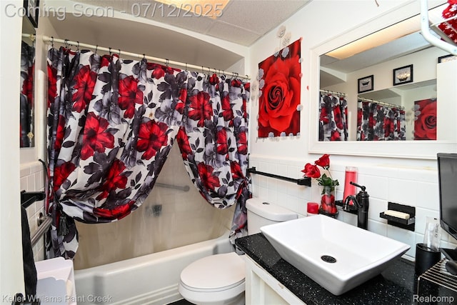 20310 Burt Rd, Detroit, MI 48219 - full bathroom with shower / bath combo with shower curtain, tile walls, vanity, and a wainscoted wall