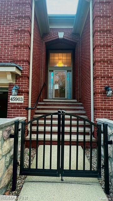 45903 Dutton Dr, Shelby Twp, MI 48044 - property entrance with brick siding