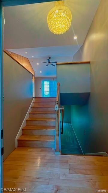 45903 Dutton Dr, Shelby Twp, MI 48044 - stairs featuring wood-type flooring, ceiling fan, and recessed lighting