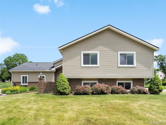 890 Darwin Place Ct, Rochester Hills, MI 48307 - rear view of property featuring brick siding and a yard