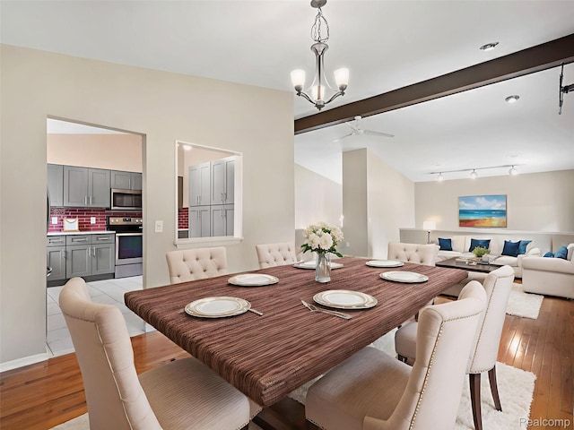 890 Darwin Place Ct, Rochester Hills, MI 48307 - dining space featuring rail lighting, light wood-style flooring, and a chandelier