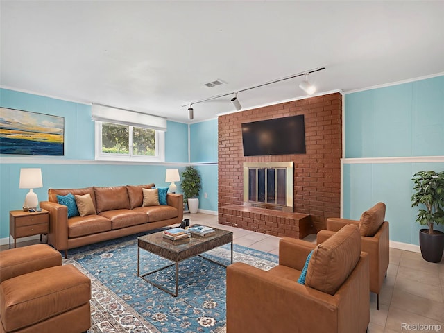 890 Darwin Place Ct, Rochester Hills, MI 48307 - living area featuring rail lighting, tile patterned floors, a decorative wall, and a brick fireplace