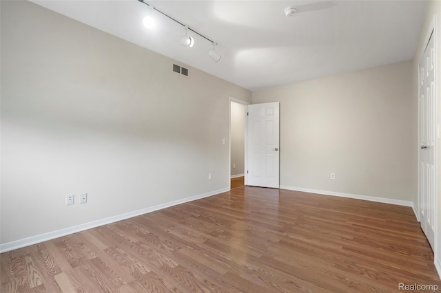 890 Darwin Place Ct, Rochester Hills, MI 48307 - empty room with track lighting and wood finished floors