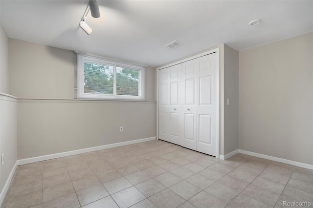890 Darwin Place Ct, Rochester Hills, MI 48307 - unfurnished bedroom featuring a closet and tile patterned flooring