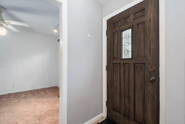 2736 Cascade Rd SE, Grand Rapids, MI 49506 - carpeted entryway featuring a ceiling fan and baseboards