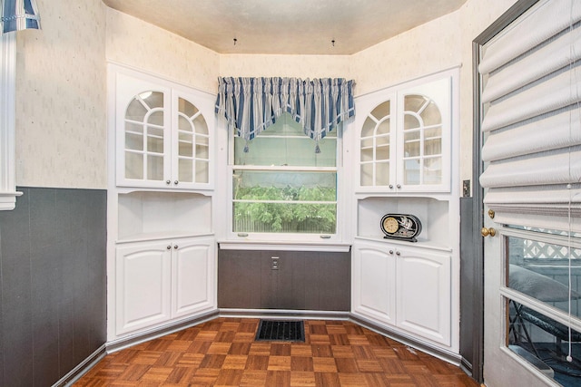 2736 Cascade Rd SE, Grand Rapids, MI 49506 - kitchen with white cabinetry and glass insert cabinets