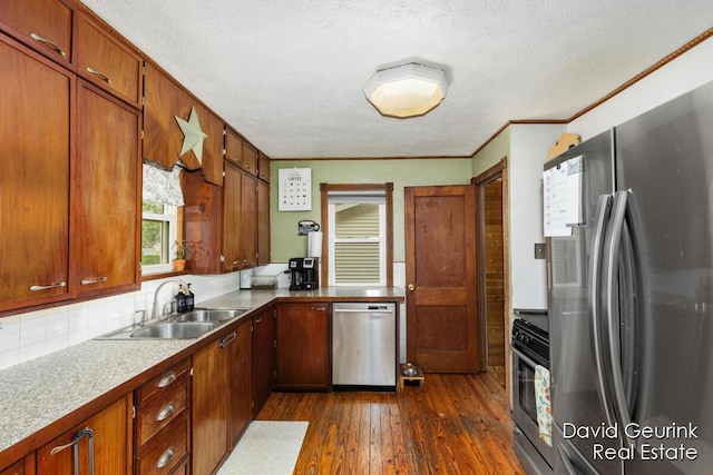 730 S 160th Ave, Holland, MI 49423 - kitchen with stainless steel appliances, dark wood-type flooring, backsplash, brown cabinetry, and crown molding