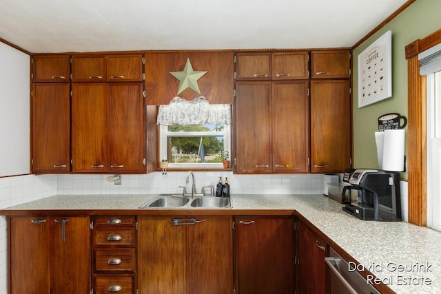 730 S 160th Ave, Holland, MI 49423 - kitchen featuring light countertops, tasteful backsplash, and brown cabinetry
