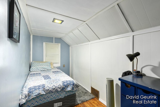 730 S 160th Ave, Holland, MI 49423 - bedroom featuring wood finished floors and lofted ceiling