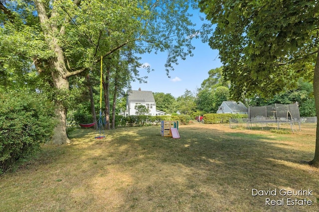 730 S 160th Ave, Holland, MI 49423 - view of yard with a trampoline