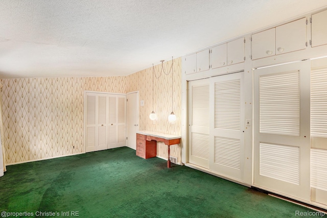 1014 Key W Dr, Clawson, MI 48017 - unfurnished bedroom with carpet flooring, multiple closets, and a textured ceiling
