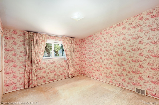 1014 Key W Dr, Clawson, MI 48017 - carpeted empty room featuring wallpapered walls