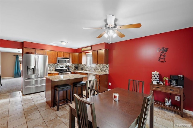16322 Canterbury Ct, Macomb, MI 48044 - dining area with a ceiling fan and baseboards