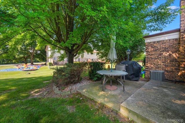 16322 Canterbury Ct, Macomb, MI 48044 - view of grassy yard featuring a patio area