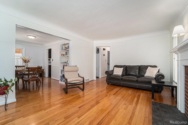 20874 Woodmont St, Harper Woods, MI 48225 - living room featuring light wood finished floors