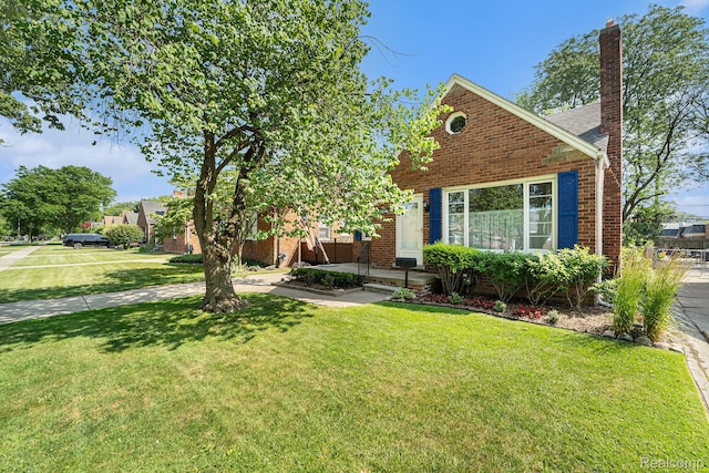 20874 Woodmont St, Harper Woods, MI 48225 - view of front of home with brick siding, a chimney, and a front lawn