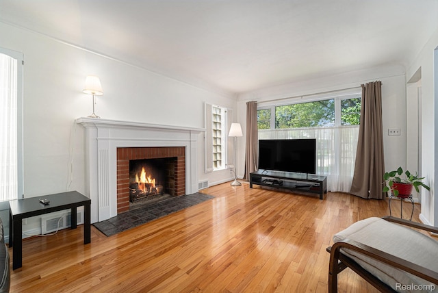 20874 Woodmont St, Harper Woods, MI 48225 - living room featuring a fireplace and wood finished floors