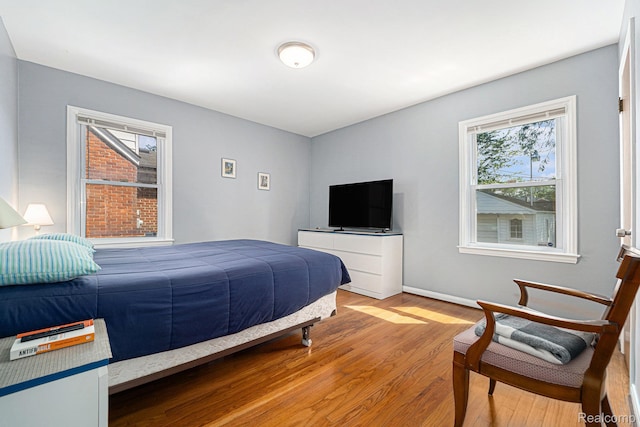 20874 Woodmont St, Harper Woods, MI 48225 - bedroom featuring light wood-style flooring and baseboards