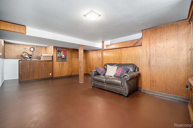20874 Woodmont St, Harper Woods, MI 48225 - living area featuring concrete flooring and wood walls