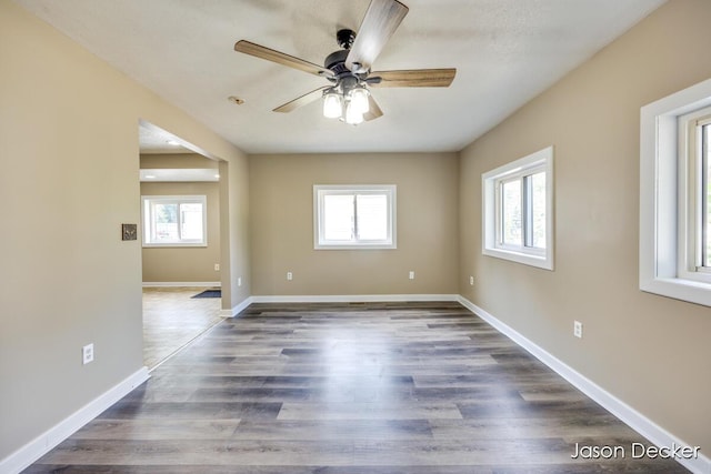 1440 College Ave NE, Grand Rapids, MI 49505 - unfurnished room with ceiling fan and dark wood finished floors
