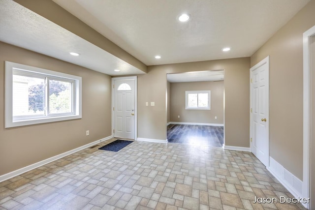 1440 College Ave NE, Grand Rapids, MI 49505 - entrance foyer featuring recessed lighting and brick patterned flooring