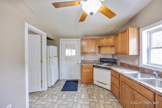 1440 College Ave NE, Grand Rapids, MI 49505 - kitchen with white appliances, lofted ceiling, ceiling fan, and light countertops