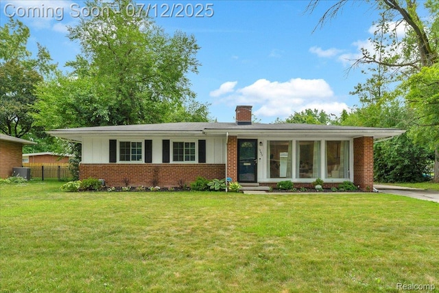 19425 Butternut Ln, Southfield, MI 48076 - ranch-style house with brick siding and a chimney