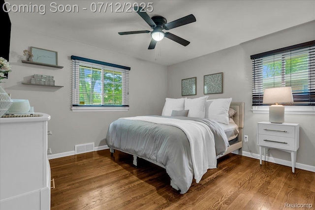 19425 Butternut Ln, Southfield, MI 48076 - bedroom with multiple windows, wood finished floors, and a ceiling fan