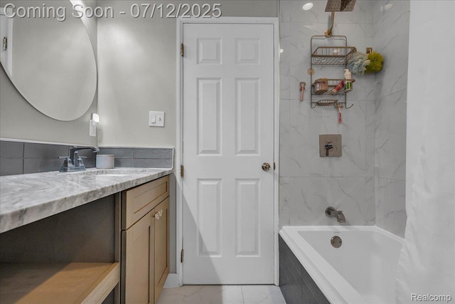 19425 Butternut Ln, Southfield, MI 48076 - full bath featuring vanity, marble finish flooring, and shower / bath combo